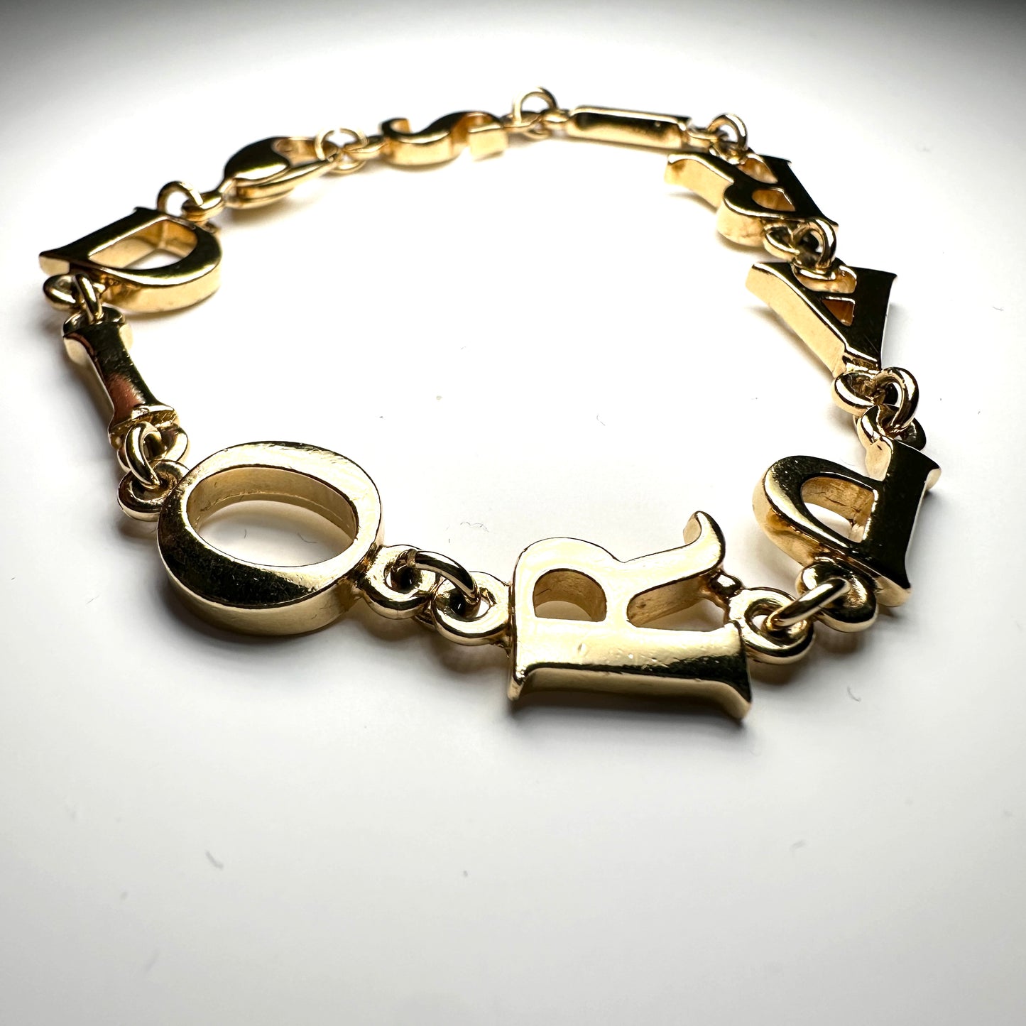 CHRISTIAN DIOR LOGO PARIS GOLD TONE BRACELET