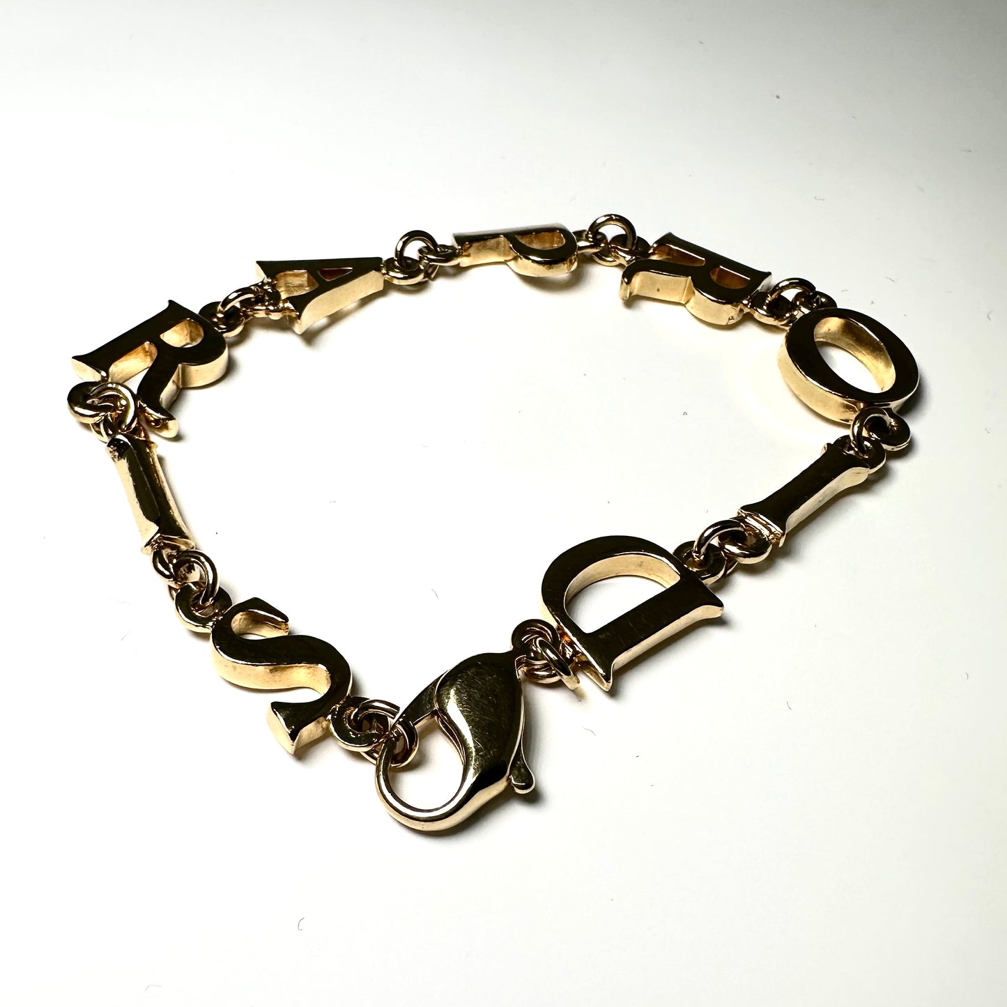 CHRISTIAN DIOR LOGO PARIS GOLD TONE BRACELET